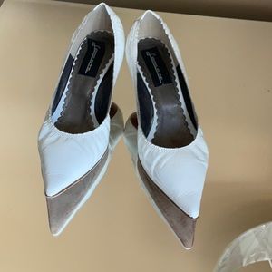 Wonderful kitten heel white patent shoes.